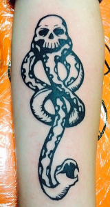 Tattoo in black ink of the Death Eater's "dark mark" from J.K. Rowling's Harry Potter by Jaesun Duggan