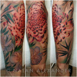 Leg tattoo in color ink of chrysanthemum and other flowers wrapping around leg by Natan Alexander