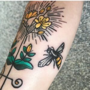 Tattoo of stylized St. John's Wort flowers with bee in color ink by K Lenore Siner